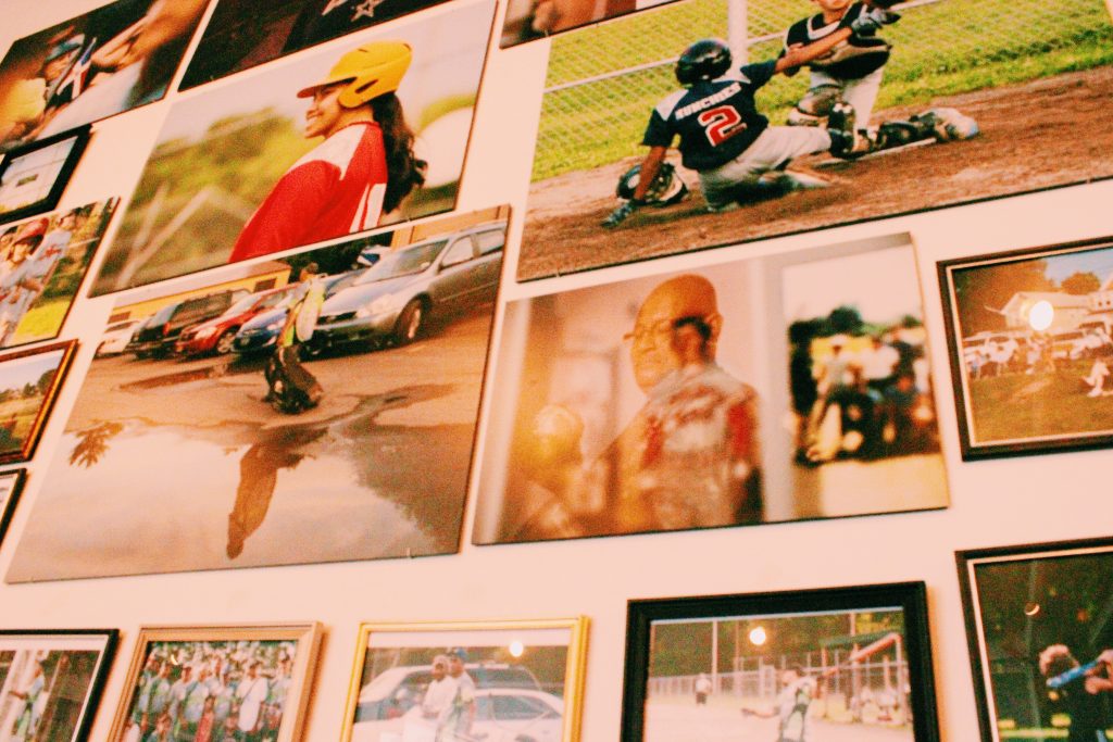Old baseball photos on a wall.