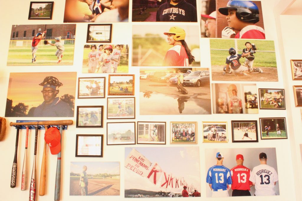 Framed and mounted baseball photos.